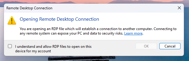 Windows first-launch Remote Desktop educational dialog, explaining what RDP files are and warning about phishing risks